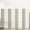 White 8-panel grid pattern shoji room divider in lifestyle room against white wall with chair and floor cushions