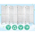 White 8-panel louvered wood room divider with eco-friendly non-toxic odourless and easy-to-clean badges on blue sky
