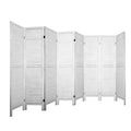 White 8-panel louvered wood room divider zigzag open configuration on white background with horizontal wood slat panels