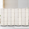 White 8-panel woven paper rope room divider in neutral lifestyle room with silver hinges and white wood frame on cream rug