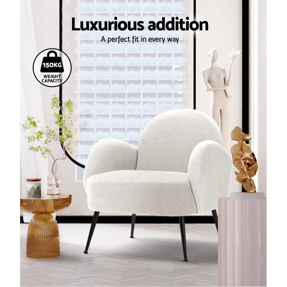 White boucle armchair in styled room with gold side table, "Luxurious addition" text and 150kg weight capacity badge
