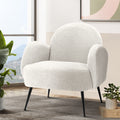 White boucle armchair near window with mountain view, tropical plant and abstract wall art in living room