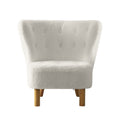 White boucle button-tufted wingback accent chair with natural wood cylindrical legs, front view on white background