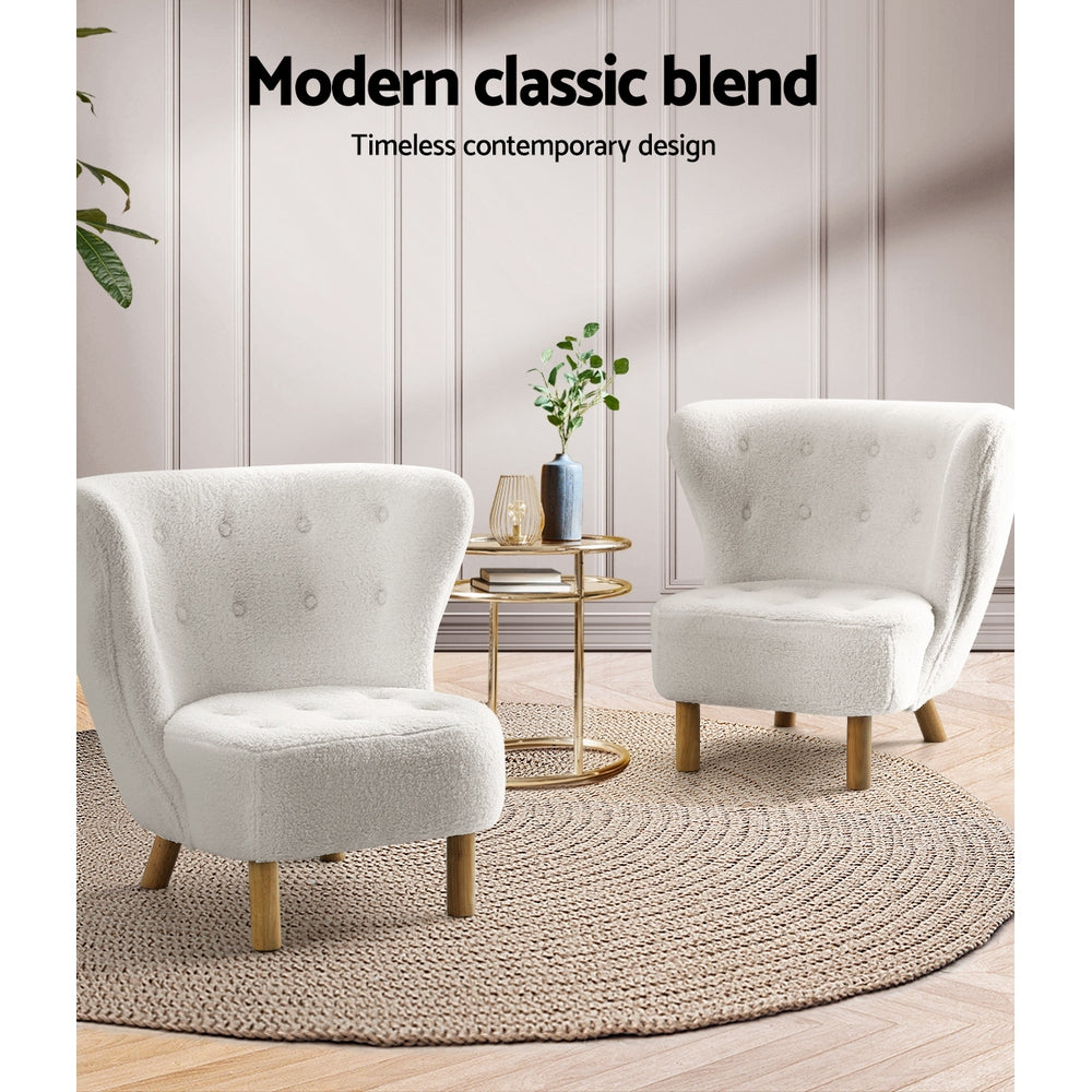 Two white boucle button-tufted wingback chairs with wood legs and gold side table on jute rug, "Modern classic blend" text