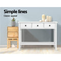 White 3-drawer console table with bottom shelf beside wooden plant stand; text 