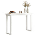 White wood-grain console table with open U-shaped legs and styled top, three-quarter angle view on white background