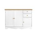 White country sideboard with two arched bead-panel doors on left, two drawers and small door on right, brass knobs, oak top