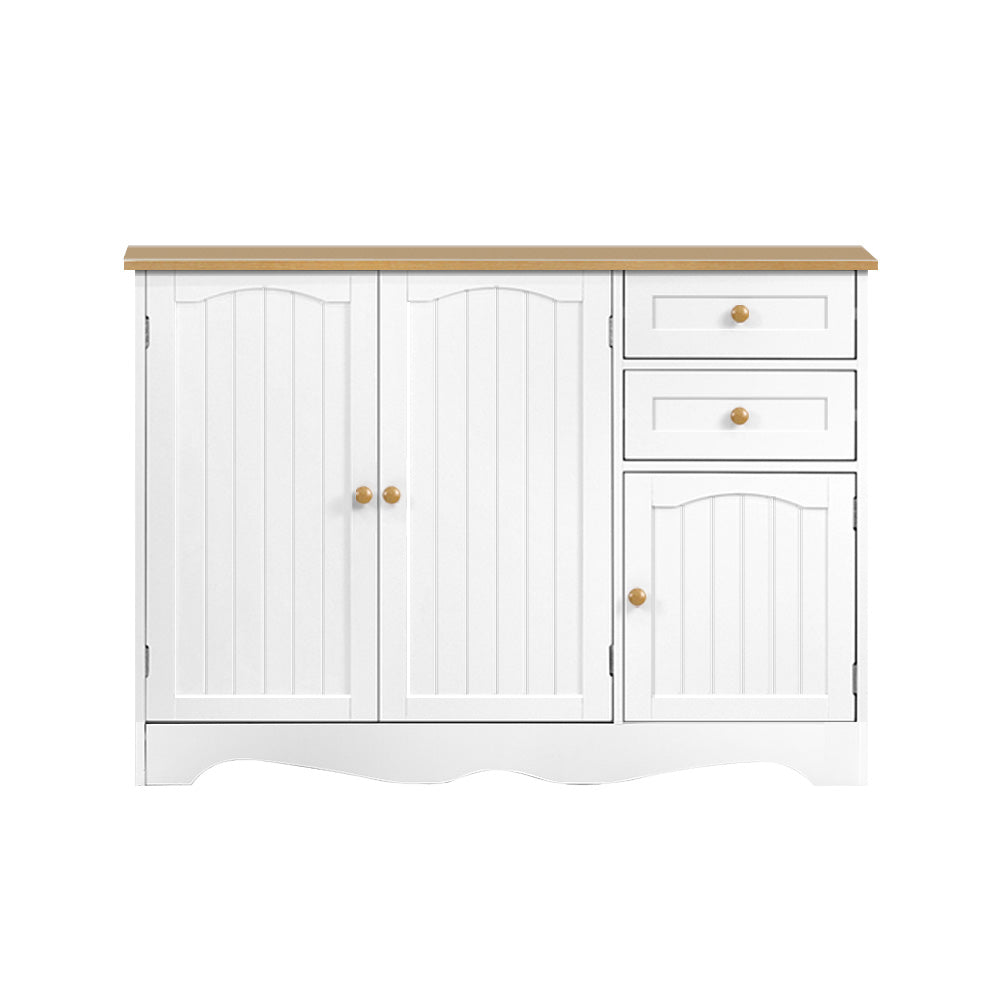 White country sideboard with two arched bead-panel doors on left, two drawers and small door on right, brass knobs, oak top