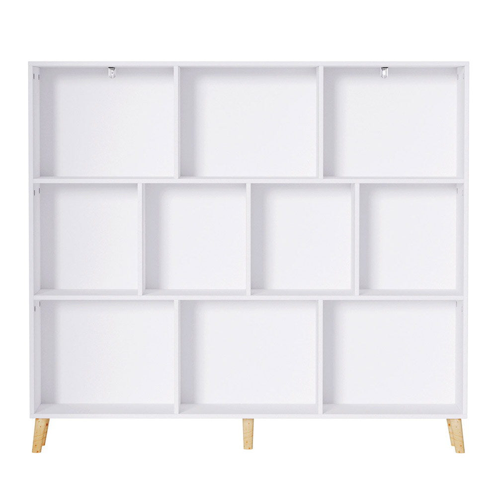 White 9-compartment cube bookshelf on four angled natural wood legs, front view on white background