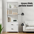 White 3-tier bookshelf with two drawers in living room, text reads 12mm thick particle board, 10kg shelf capacity, 5kg drawers