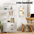 White 3-tier bookshelf with two drawers styled with books in home office setting, text reads 3-tier bookshelf