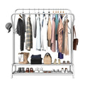 White double-rail garment rack on white background loaded with shirts jackets bags and shoes on bottom shelf
