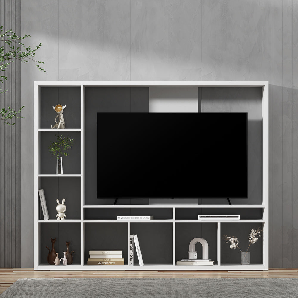 White large entertainment wall unit with TV mounted above showing open shelves with books and decor