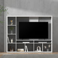 White large entertainment wall unit with TV mounted above showing open shelves with books and decor
