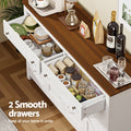 Top-down view of two open white sideboard drawers showing dishes and pantry jars, text reads 2 Smooth drawers