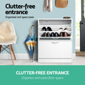 White flip-down shoe cabinet in hallway with top door open showing stored shoes clutter-free entrance text