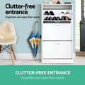 White 3-door flip shoe cabinet with top compartment flipped open displaying stored shoes inside