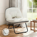 White padded foldable saucer chair with black metal frame and piped edge, in room by window, inset showing folded form