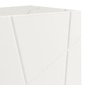 Close-up of white geometric buffet top-left corner showing marble-effect top with gold veining and diagonal line door pattern