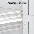 Interior close-up of white display cabinet showing adjustable shelf pin positions and arrows, text reads Adjustable shelves