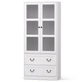White tall display cabinet with frosted glass upper doors and two drawers with bail handles, angled on white background