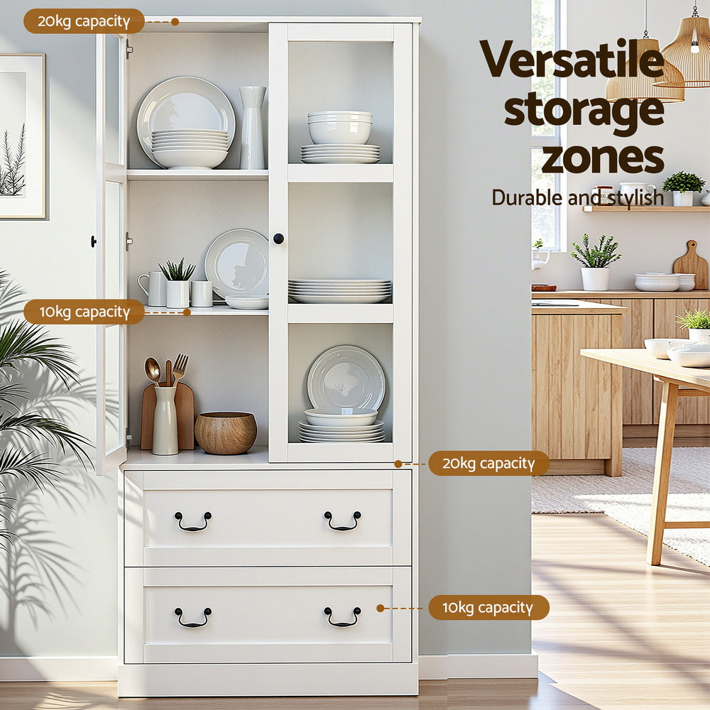 White display cabinet in dining room with capacity labels: 20kg and 10kg shelves, 20kg and 10kg drawers, dishes inside