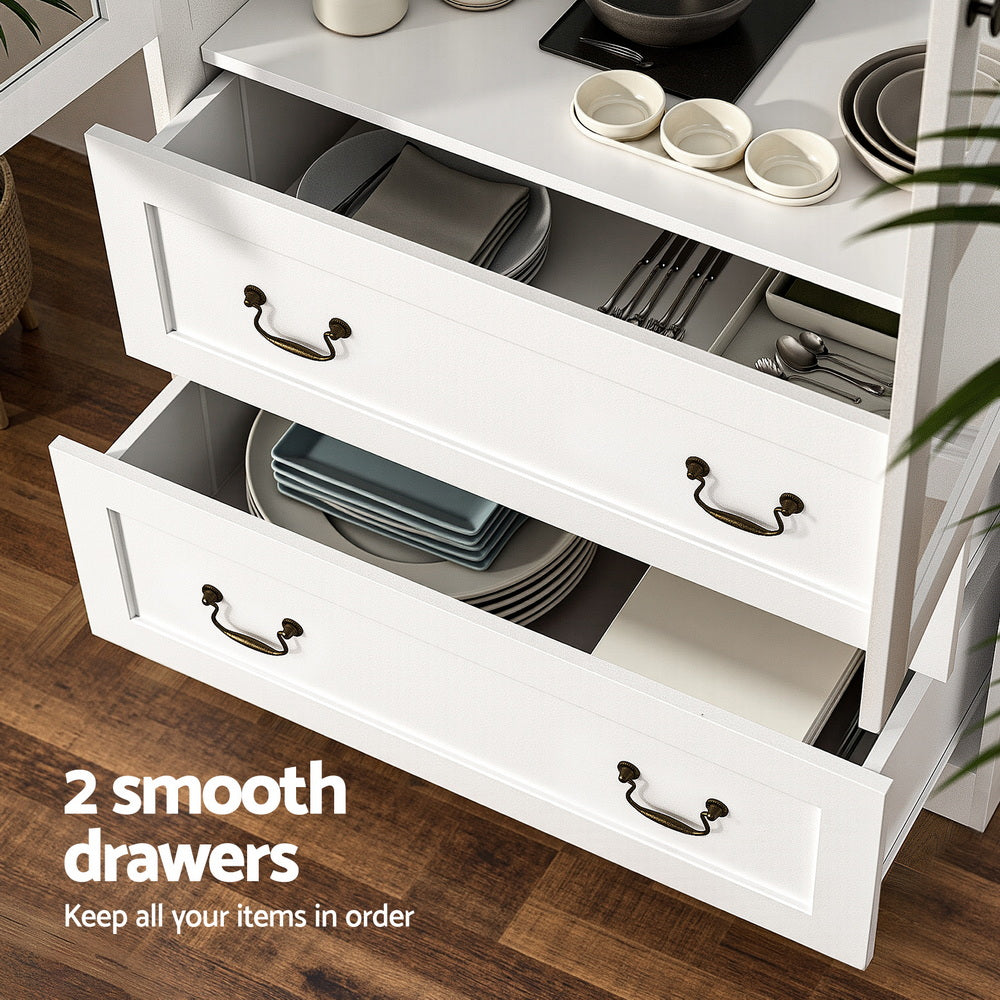 Two open white display cabinet drawers showing dishes and cutlery inside, bronze bail handles, text reads 2 smooth drawers