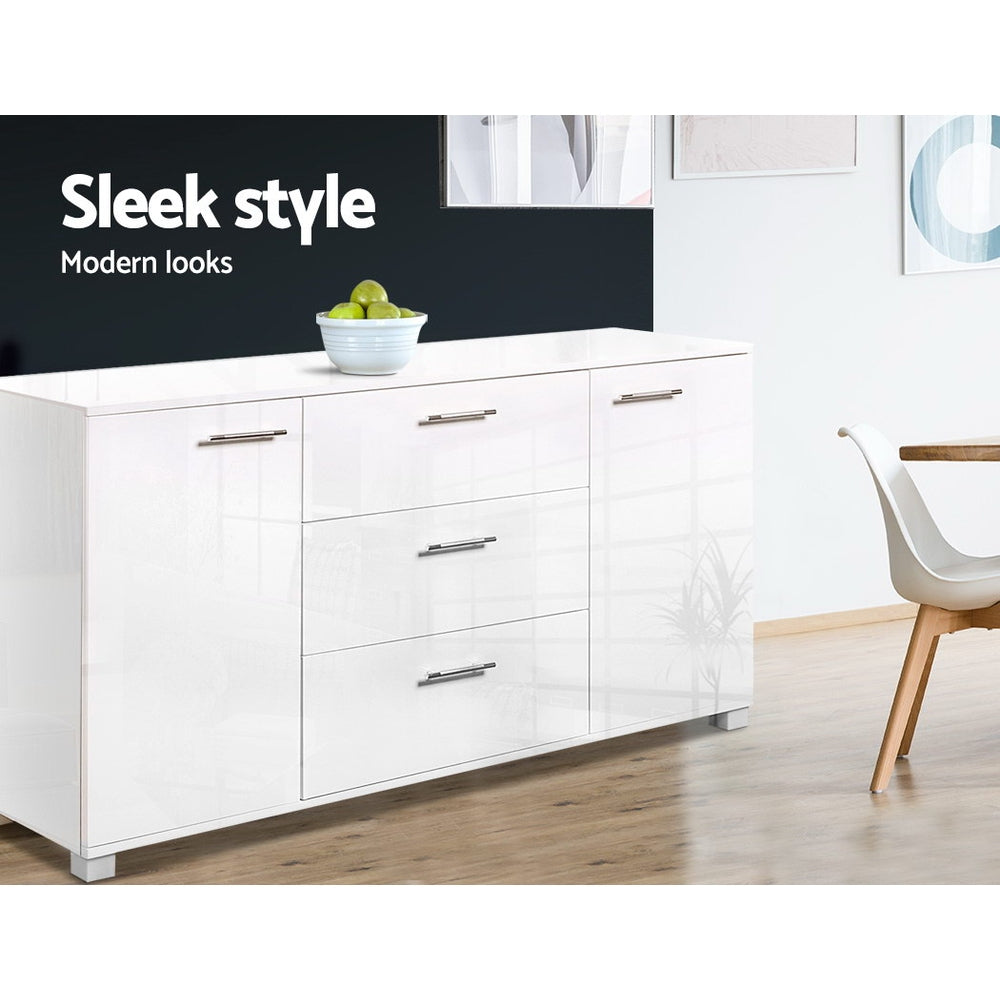 White gloss buffet in dining area with dark wall, fruit bowl on top, white chair beside; text: sleek style, modern looks