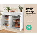 White gloss shoe cabinet open showing heels boots and sandals on shelves with stylish storage up to 24 pairs text