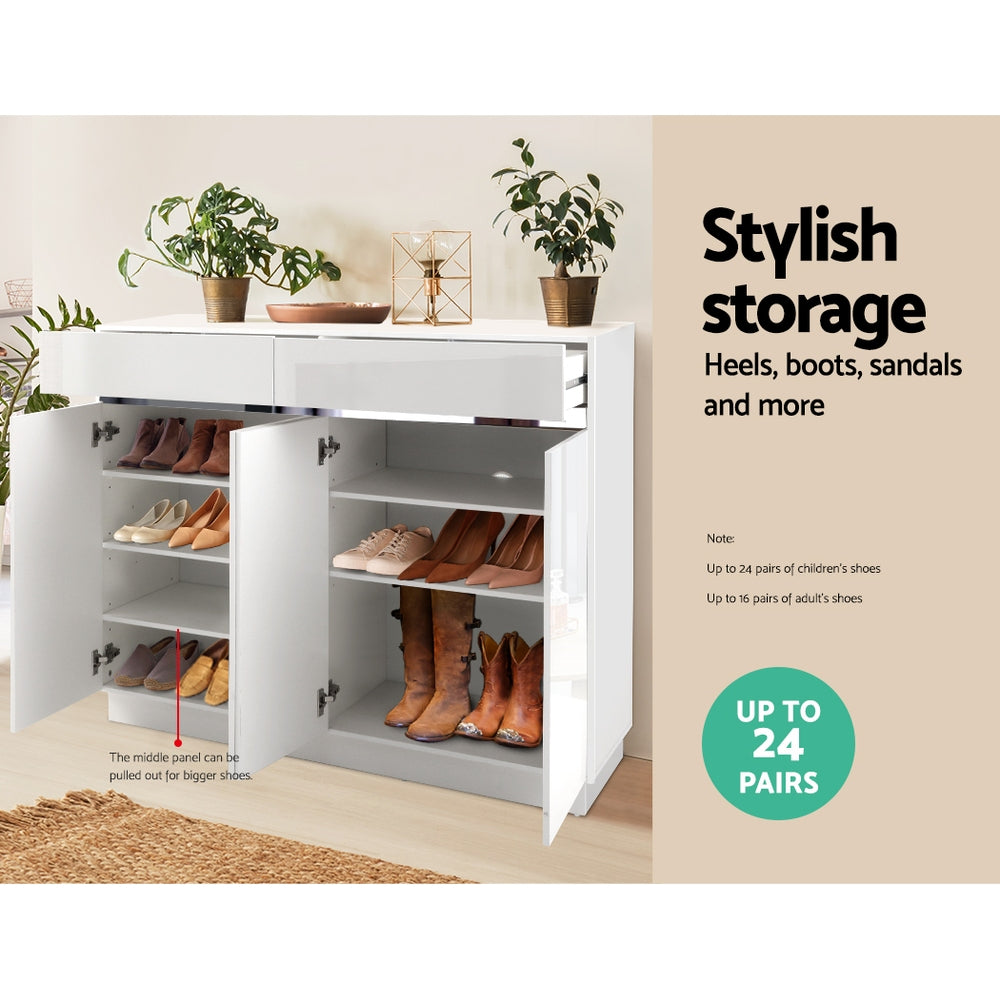 White gloss shoe cabinet open showing heels boots and sandals on shelves with stylish storage up to 24 pairs text