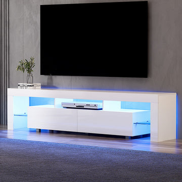 White glossy LED TV unit 200cm in dark grey room with blue LED glow disc player and plant on top