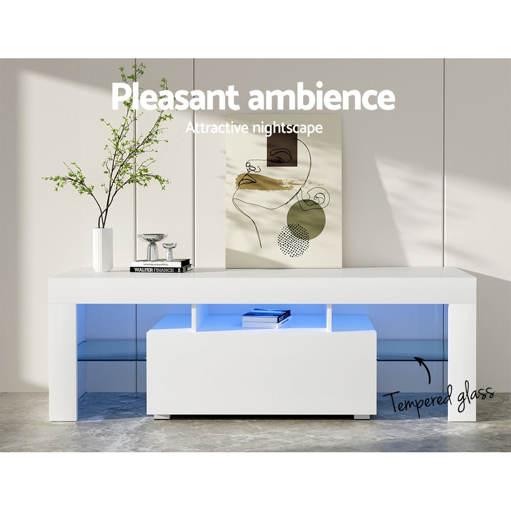 White glossy LED TV unit 130cm pleasant ambience lifestyle with blue LED vase and Walter Finance book