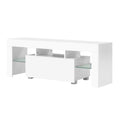 White glossy LED TV unit 130cm angle view on white background one center drop-down door and side glass shelves