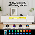 White glossy LED TV unit 180cm 16 LED colours 4 flashing modes colour swatch strip and 24-key remote in lifestyle room