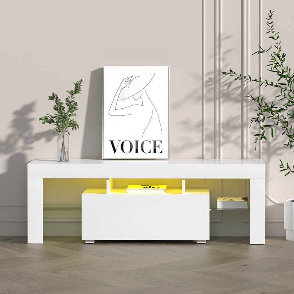 White glossy LED TV unit 189cm lifestyle with warm yellow LED VOICE art print green plants and books