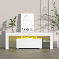 White glossy LED TV unit 189cm lifestyle with warm yellow LED VOICE art print green plants and books