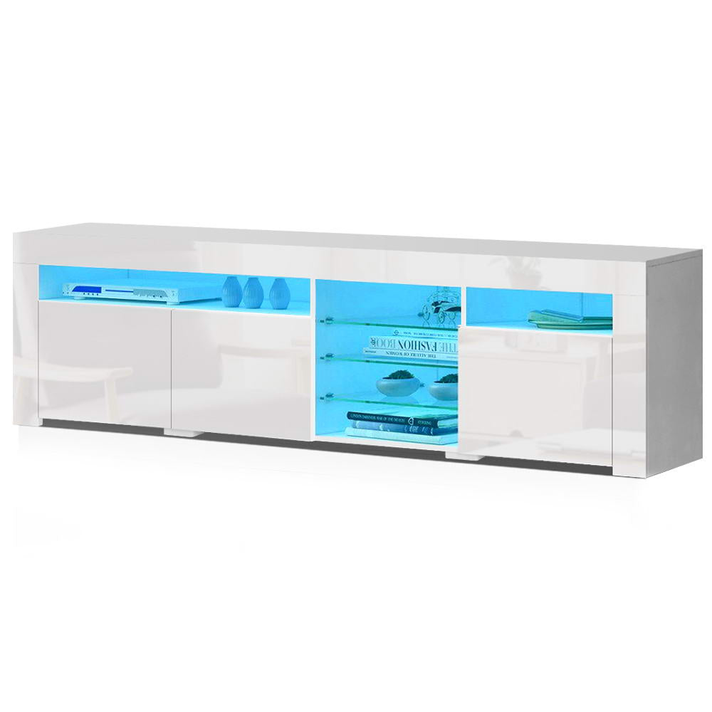 White glossy LED TV unit 180cm angle view with blue LED lit shelves showing books and bowls on white background