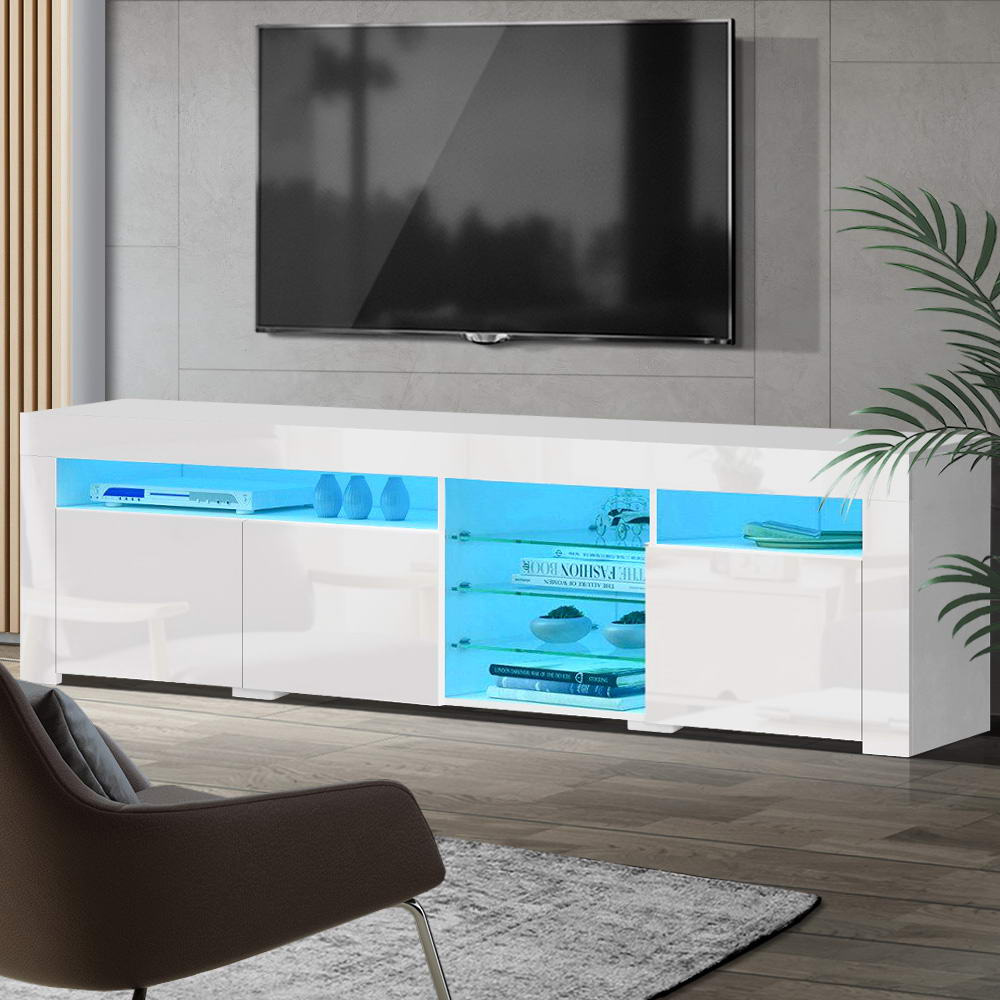 White glossy LED TV unit 180cm in living room with blue LED illuminating glass shelves and vases on top