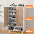 White herringbone shoe cabinet open with shoes and capacity labels: 20kg top, 5kg per shelf, 5kg base