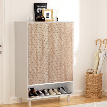 White shoe cabinet with herringbone oak doors and open bottom shelf in entryway with umbrella stand