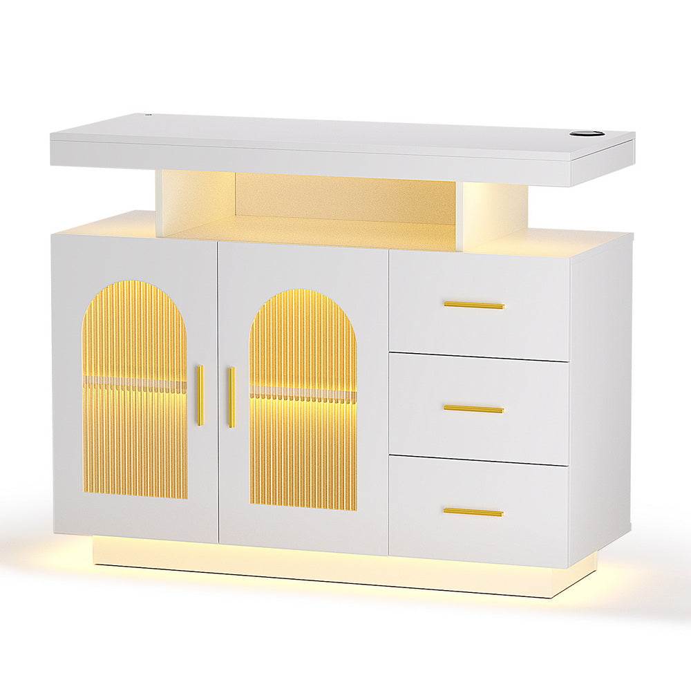 White LED sideboard with floating shelf, two arch fluted glass doors, three drawers with gold handles and LED base glow