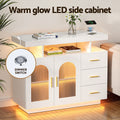 White LED arch sideboard in room with warm gold LED glow, books and phone charging on top, dimmer switch inset