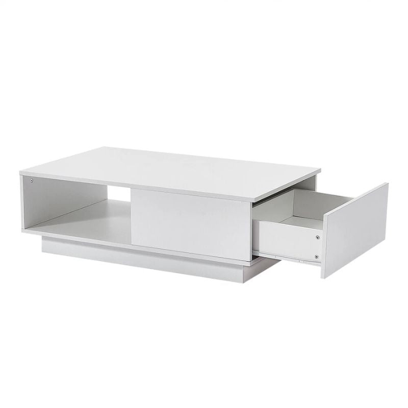 White high-gloss coffee table at angle, drawer pulled open on right side, open shelf compartment on left, white background