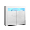 White high-gloss sideboard with blue LED strip, two gloss doors and decor on top, angled on white background