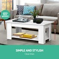 Close-up of white lift-top coffee table mechanism with lid partially lifted