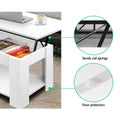 White lift-top coffee table in use with lid open and laptop placed on raised surface