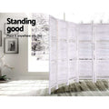White louvered wood room divider 170cm height infographic in lifestyle room with framed wall photos and orchid plant