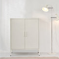 White metal two-door locker cabinet with centre handles and vent slots on base frame in room with white floor lamp