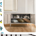 White metal locker cabinet doors open showing interior shelf with books and cushions stored in lifestyle room setting