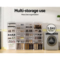 White modular 16-cube shoe cabinet loaded with shoes in room, 2.5KG load per panel badge visible